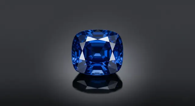 Colored gemstone photographed with backlight showing transparency and color
