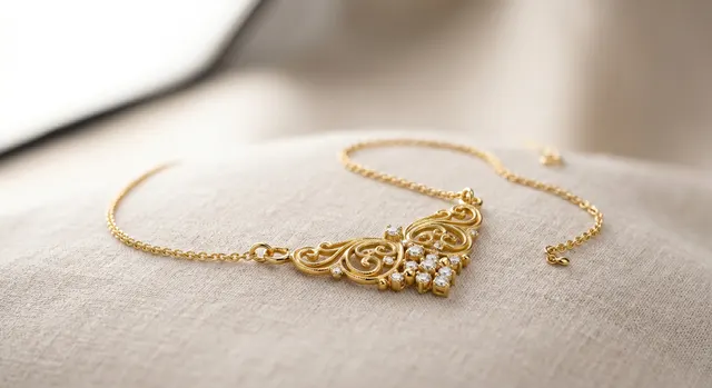 Gold ring and chain photographed with warm, controlled reflections