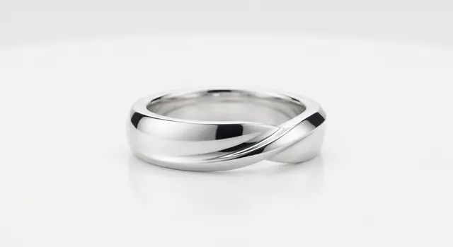 Polished silver ring photographed in a light tent with clean reflections