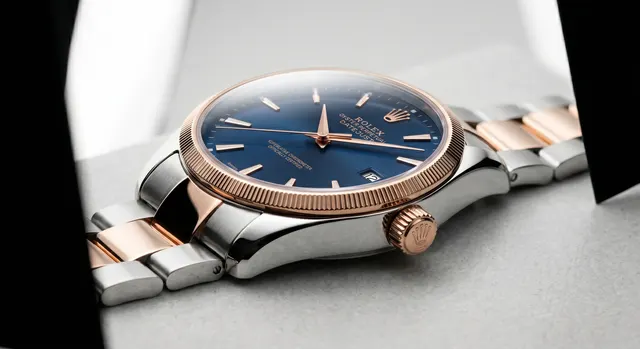 Wristwatch photographed with a clean dial and controlled crystal reflections